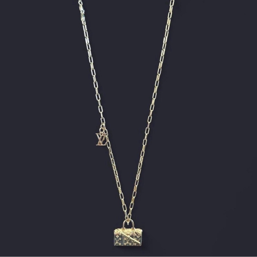Gold tone necklace with upcycled charms